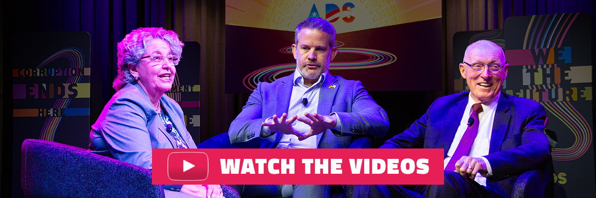 Image of Ellen Weintraub, Adam Kinzinger and Rusty Bowers sitting together, with a button that says Watch the Videos at the bottom