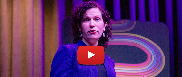 Maria McFarland Sanchez-Moreno sharing her story on stage